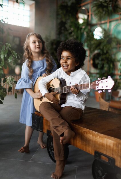 Photo children play the guitar