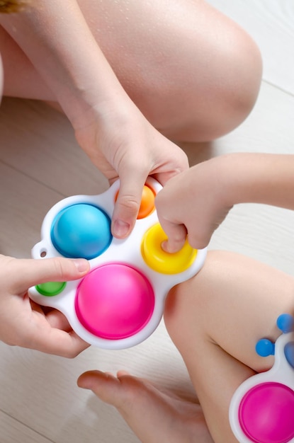 Children play with simple dimple Children's hands holding a modern simple dimple