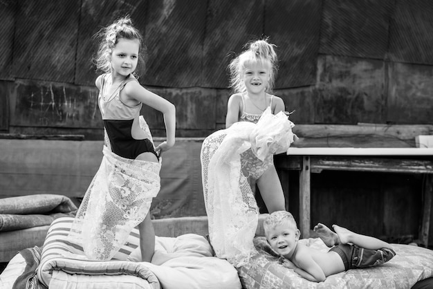 Children playing in the courtyard of a house in the village