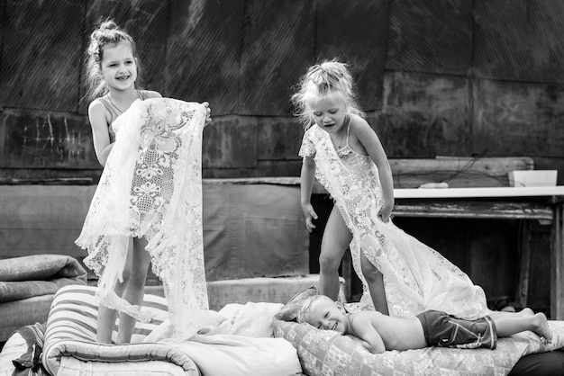 Children playing in the courtyard of a house in the village