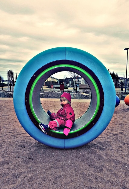 Photo children playing in playground against sky