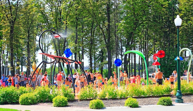 children playing on playground with their parents with fountains in Gorky Park in Kharkiv Palace on playground Fun for young children