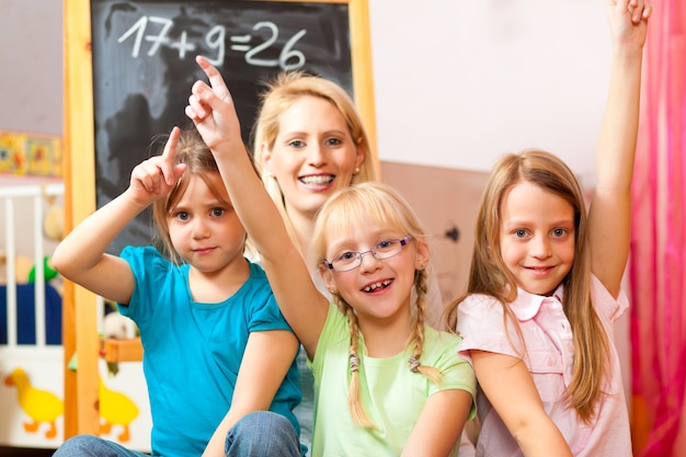 Children playing school at home