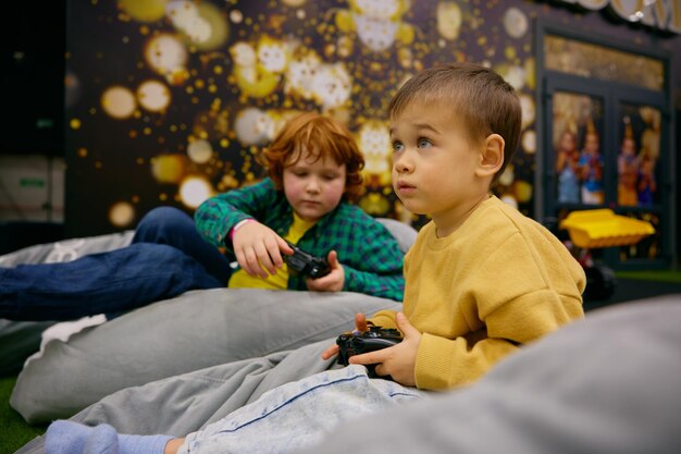 Children playing video game in entertainment center