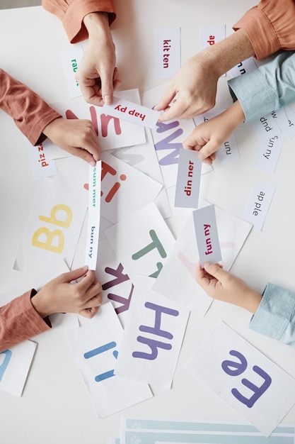 Children playing with cards at lesson