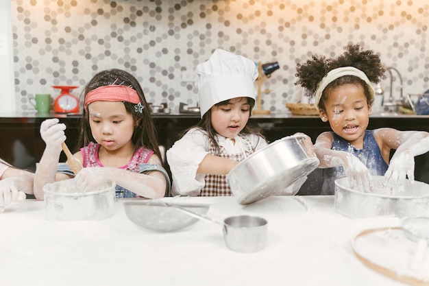 Photo children preparing food in kitchen at home