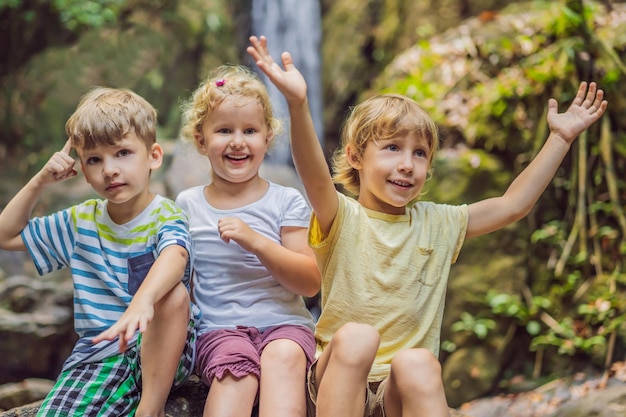 Children rest during a hike in the woods