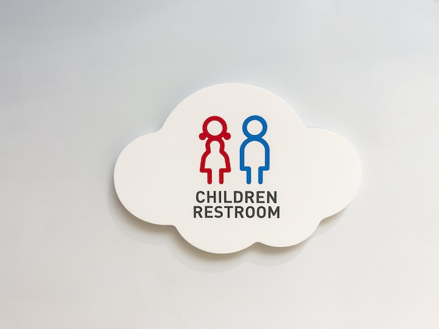 Children restroom sign on white wall Copy space background