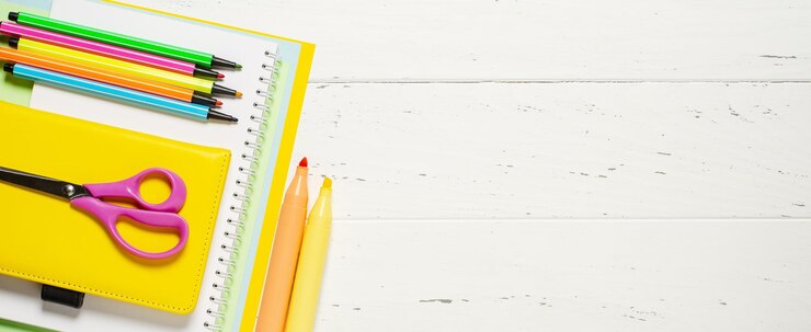 Children's accessories for study creativity and office supplies on a white wooden background Back to school concept Copy space