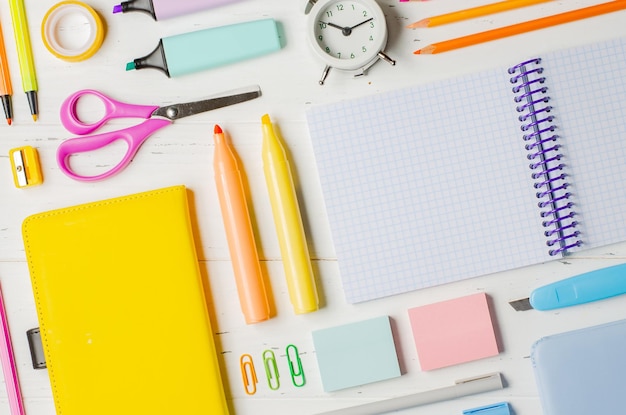 Children's accessories for study creativity and office supplies on a white wooden background Back to school concept Copy space