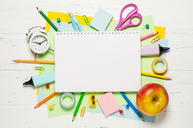 Children's accessories for study creativity and office supplies on a white wooden background Back to school concept Copy space