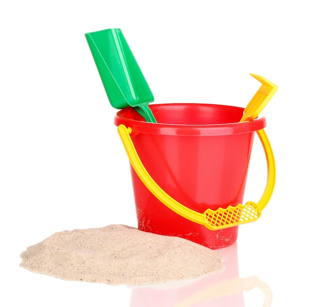 Children's beach toys and sand isolated on white