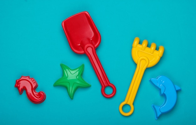 Children's beach toys, or sandbox toys on blue