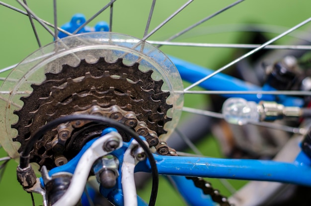 Children's bike repair View of the rear wheel and cassette closeup Rusty old parts are replaced by new ones High quality workshop Rear derailleur broke