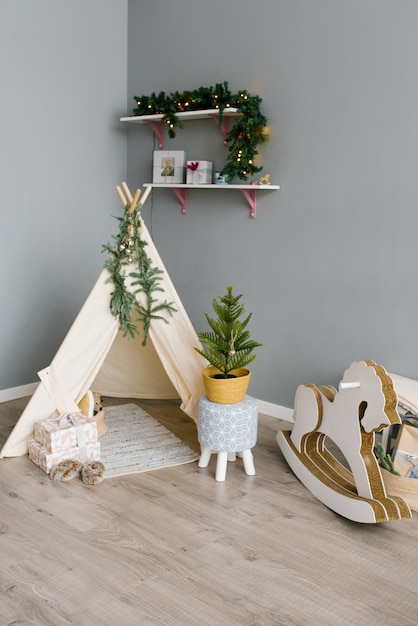 Children's corner in the room, decorated for Christmas and New Year