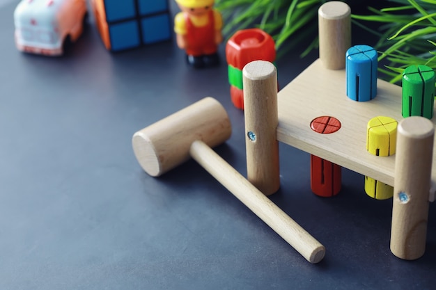 Children\'s development. children\'s wooden toy on the table in\
the play area. room of children\'s creativity and self-development.\
wooden constructor.