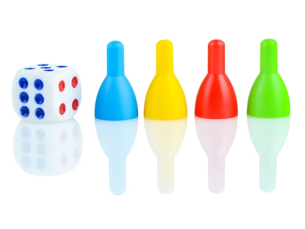 Children's dice and bowling pins in different colors on a white background.