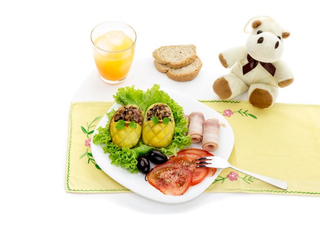 Children's dishes Children's meal stuffed with potatoes vegetables and bacon on the table closeup