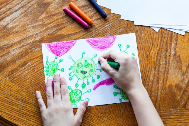 Children\'s drawing coronavirus many viruses attack the human\
body crayons, colored pencils, children\'s creativity, creating\
crafts, home decoration, time with children, skill development,\
school, home