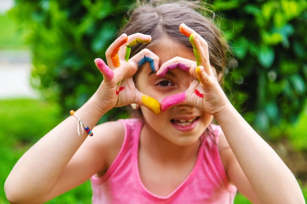 Children's hands in the colors of summer Selective focus