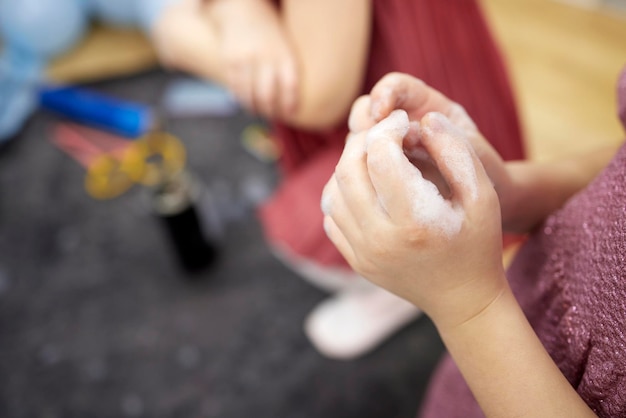 Children's hands in soapy foamClean hands concept Hygiene and health