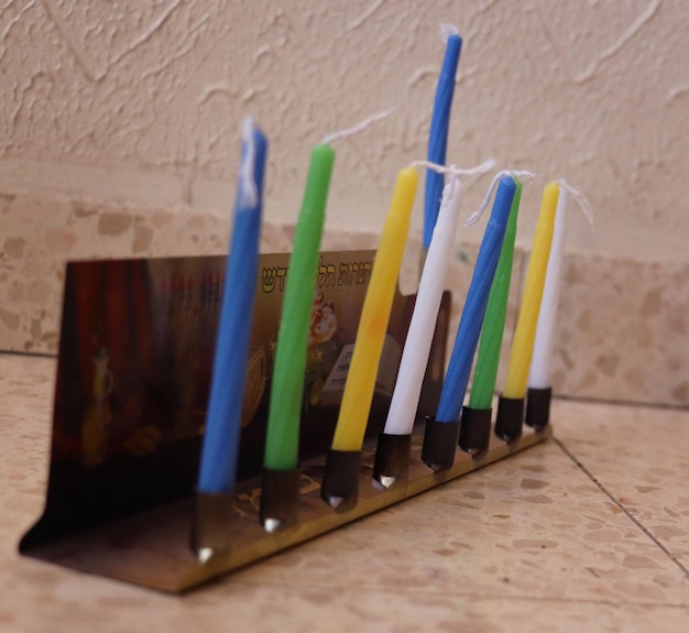 Photo children's menorah with colored candles