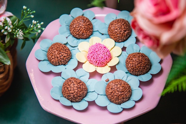 Children's party sweets chocolate brigadeiro and strawberry brigadeiro