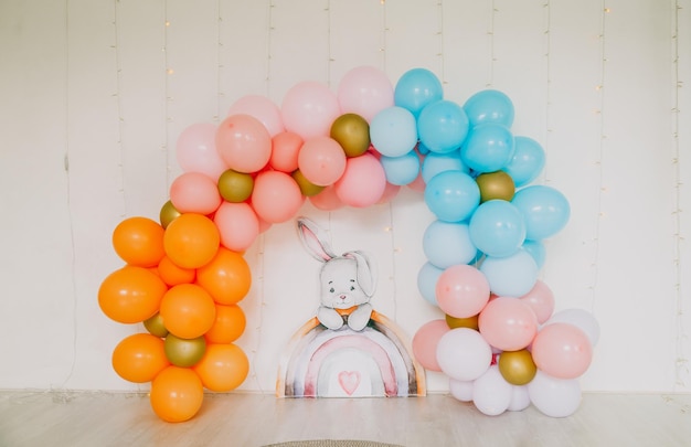 Children's photo zone of balloons in the form of a rainbow Holiday decorated with balloons