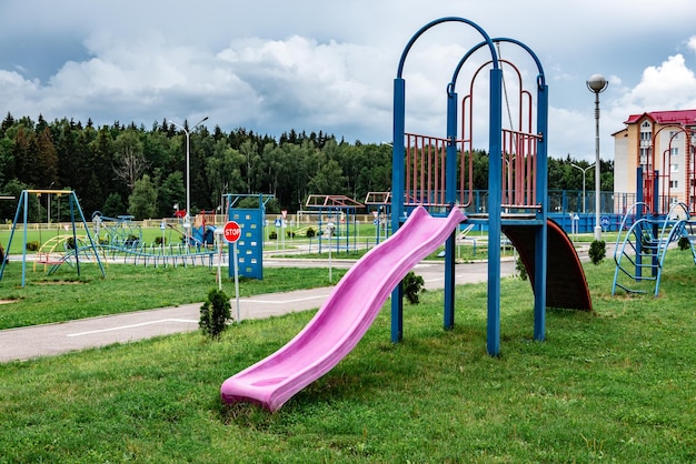 Children's plastic slide on school playground.