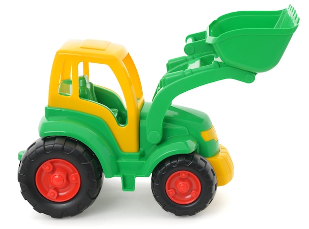 Foto giocattolo di plastica per bambini, bulldozer giallo-verde isolato su bianco