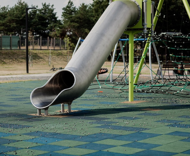 Children's playground with metal tube