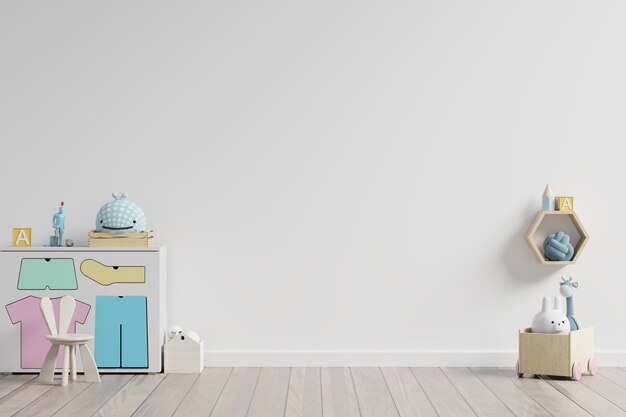  in children's playroom with cabinet and table sitting doll on empty white wall .