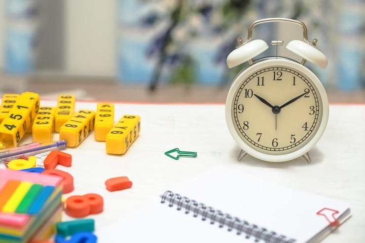 children's toys in the form of letters, numbers and an alarm clock