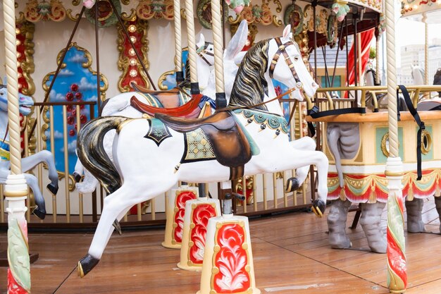 Children's vintage carousel with figures of horses