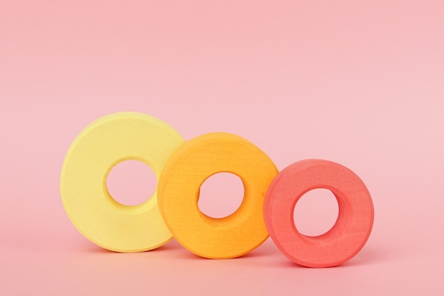 Children's wooden rings of orange and yellow