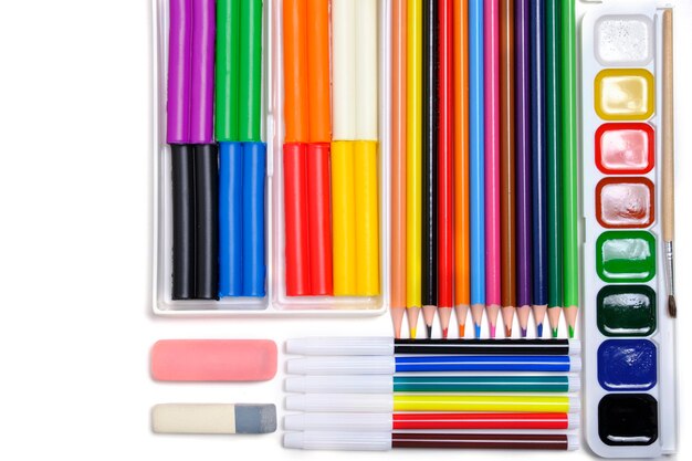 Children school set for creativity and drawing from colored pencils watercolor paints felt tip pens and plasticine