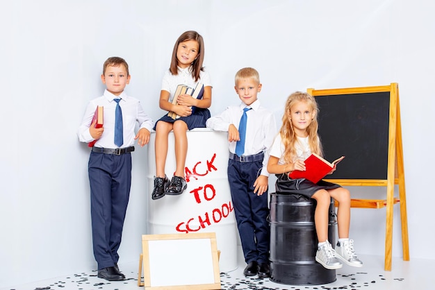 Children schoolboys boys and girls happy beautiful on a white background back to school