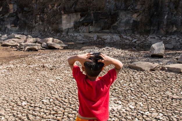 Children stressed, ground dry concept drought.