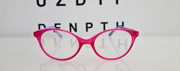 Children stylish glasses on background of ophthalmologist table