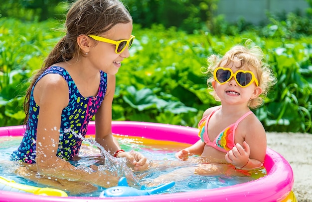 Children swim in the pool Selective focus