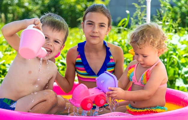 Children swim in the pool Selective focus