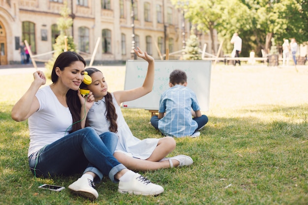 Children and teacher enjoy in park