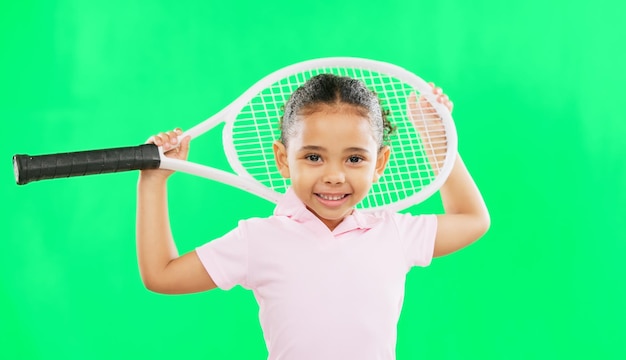 Children tennis and a girl on a green screen background in studio for sports recreation or fun portrait kids and fitness with an adorable little female child or athlete on chromakey mockup