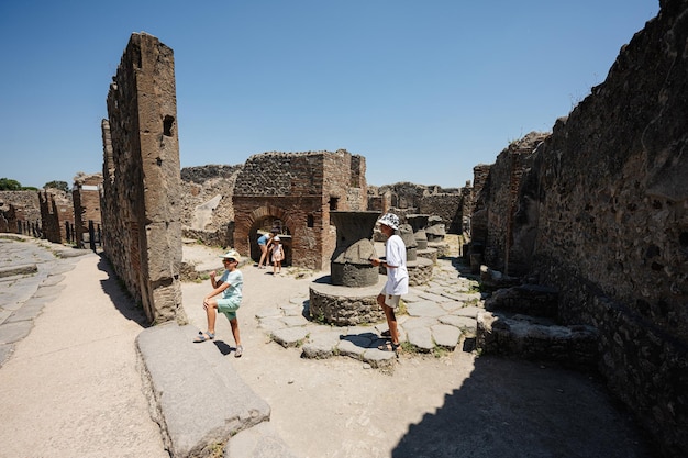 Children tourist walking at Pompeii ancient city Italy