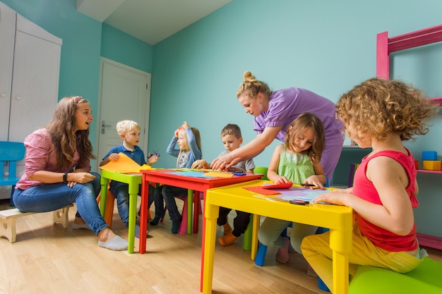 Children and tutor study together at the creative school