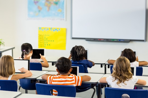 Children using digital tablets