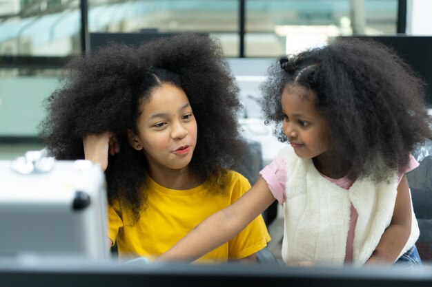 Children using the hand robot technology and having fun learning the electronic circuit board of hand robot technology which is one of the stem courses