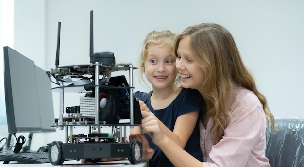 Children using the hand robot technology and having fun Learning the electronic circuit board