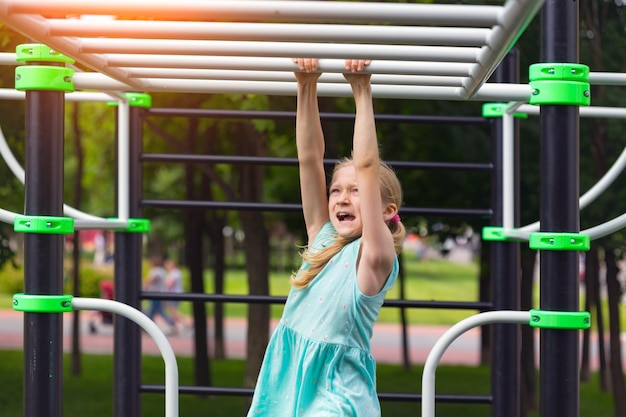 Children on vacation - little girl on the playground at the park