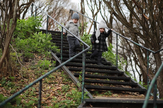 Children walk in the autumn park